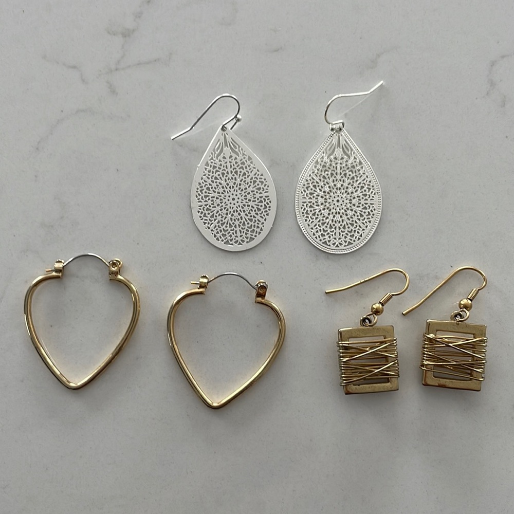 3 pair of silver and gold tone earrings. 1 1/4” - 1 1/2” length.
